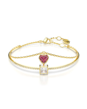 Bracciale da donna Swarovski Chroma placcato oro con una sezione rigida e cristalli e una catena con cristallo rosso a cuore 5683835