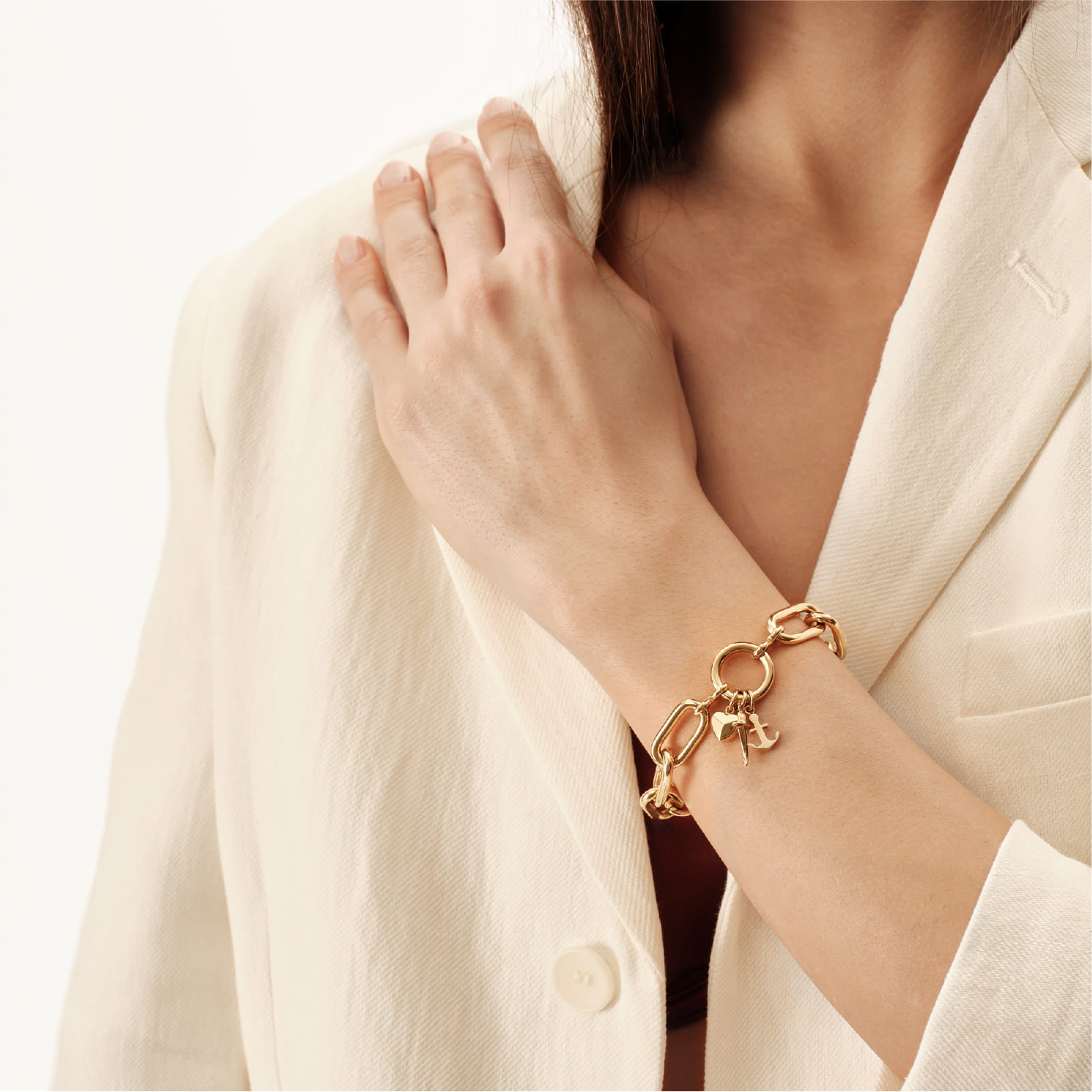 Bracciale catena Breil in acciaio dorato con tre charms 22,5 cm