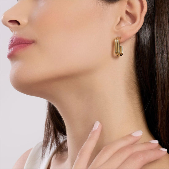 Orecchini Kidult Style in acciaio dorato con tre ovali uniti MISURA UNICA