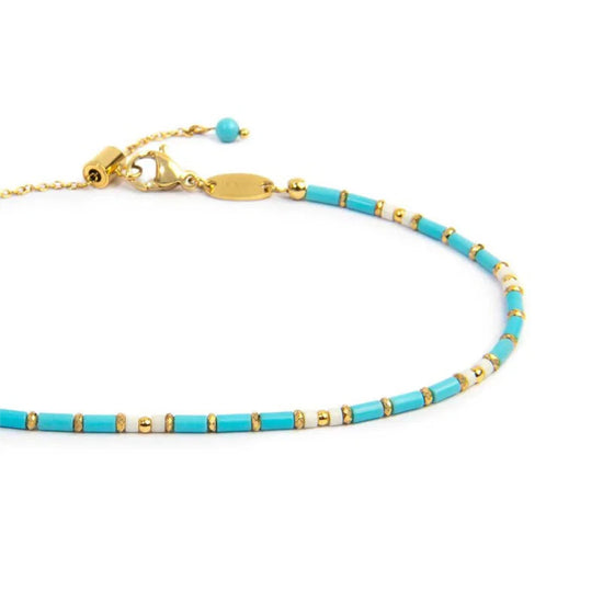 Cavigliera regolabile Marlù acciaio oro perline tubo azzurre 26 cm