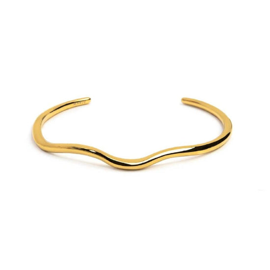 Bracciale rigido in acciaio dorato con forma organica diamentro 6 cm