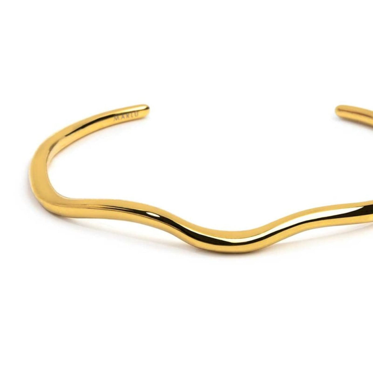 Bracciale rigido in acciaio dorato con forma organica diamentro 6 cm