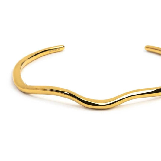 Bracciale rigido in acciaio dorato con forma organica diamentro 6 cm