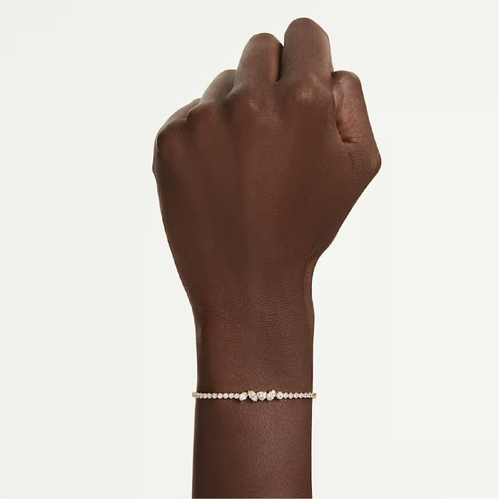 Bracciale regolabile Swarovski Mesmera lega dorata e zirconi REGOLABILE