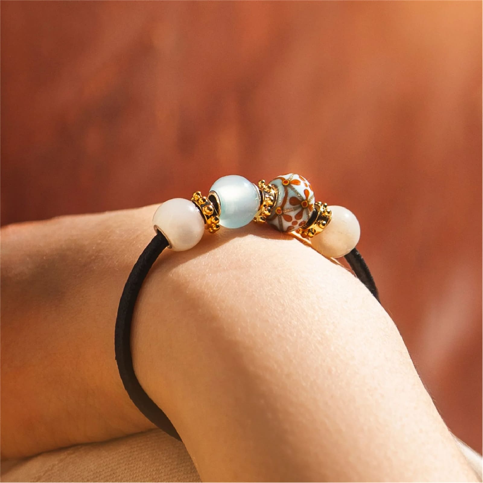 Charm Trollbeads Modernità in vetro azzurro e fiori arancio MISURA UNICA