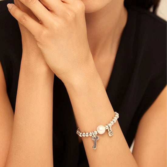 Bracciale elastico Uno de 50 in metallo con perla e charms elastico
