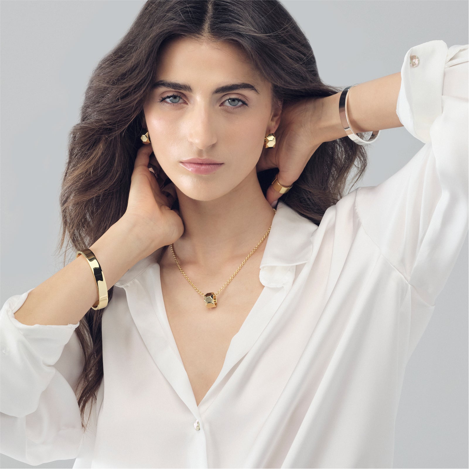Bracciale rigido Unoaerre in bronzo dorato a fascia spessa