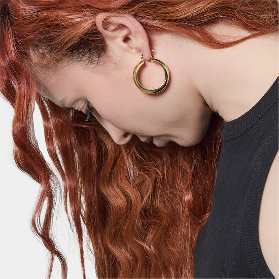 Orecchini a cerchio donna Unoaerre bronzo dorato spessi
